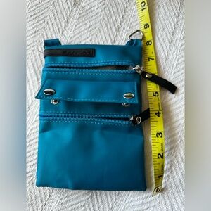Scan Safe 8”x5” Crossbody purse excellent condition. Brand new black strap!